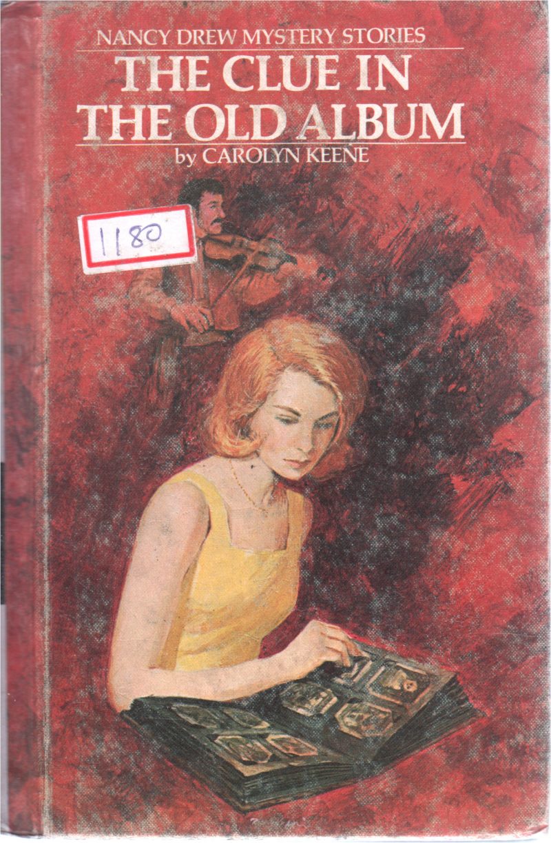 THE CLUE IN OLD ALBUM BY CAROLYN KEENE